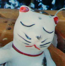 Salt and pepper shakers through a window of a shop.